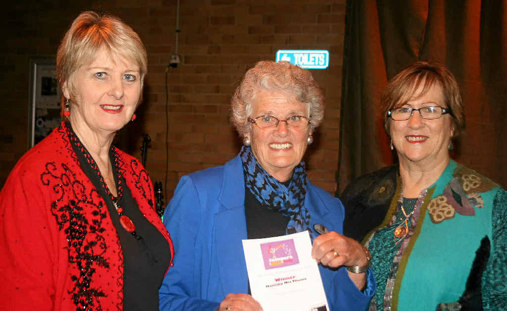 Winner of the Mamma Mia section Margaret Armstrong is congratulated by judges Lyn Baxter and Sue Ford.